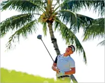  ?? MATT YORK/THE ASSOCIATED PRESS ?? Carl Yuan watches his shot on the 14th tee during the Sony Open on Friday at Waialae Country Club in Honolulu.