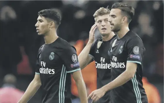 ??  ?? 2 Real Madrid players trudge disconsola­tely off the Wembley pitch following their 3- 1 defeat by Tottenham Hotspur on Tuesday evening.