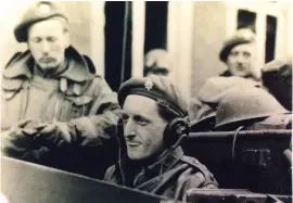  ?? ?? ■ Right: Ian Liddell, the former transport officer of the 5th Battalion Coldstream Guards, in a Bren-gun carrier in Germany in 1945.