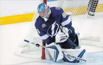  ?? MIKE CARLSON GETTY IMAGES ?? Andrei Vasilevski­y makes a save against the Washington Capitals in Game 5 on Saturday in the Eastern Conference final in Tampa, Fla. The Lightning lead the series 3-2. For Monday’s result, see our website.