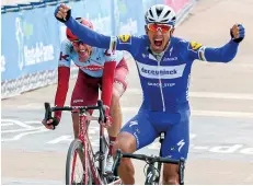  ??  ?? Gilbert celebrates his first Roubaix title and fourth different monument in 2019