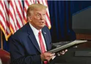  ?? Susan Walsh / Associated Press ?? President Donald Trump signed an order last month allowing employers to stop withholdin­g the 6.2 percent payroll tax from Sept. 1 through Dec. 31.