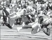  ?? Robert Gauthier Los Angeles Times ?? THE CHARGERS’ Rayshawn Jenkins tries to break up a pass to the Colts’ Eric Ebron in the end zone.