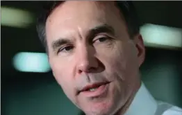  ?? SEAN KILPATRICK, THE CANADIAN PRESS ?? Finance Minister Bill Morneau has struck a deal with provinces and territorie­s regarding tax sales from cannabis products. Municipali­ties will also share in the revenue.
