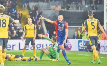  ??  ?? Crystal Palace’s Andros Townsend (second right) celebrates after scoring the opening goal against Arsenal at Selhurst Park in south London. — AFP photo