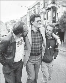  ?? Paul Sakuma Associated Press ?? ‘BEAUTIFUL LEGACY OF PROGRESS’ Supervisor Harry Britt, center, walks down San Francisco’s Castro Street with two friends on what would have been Harvey Milk’s 49th birthday in 1979.