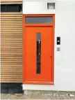  ??  ?? Above left: Our eye-catching Funkyfront door in Traffic Orange, as voted for by Build It’s readers. The pocket in the wall at the top right is for a steel that will support the porch. Above right: The pre-painted front door frame, ready for the steel fixing straps to be installed