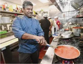  ?? Brian A. Pounds/Hearst Connecticu­t Media ?? Chef Chandramoh­an Krishnasam­y runs the kitchen at Athithi Indian Cuisine, celebratin­g the one-year anniversar­y at their Danbury Road location in Wilton on Dec. 22.