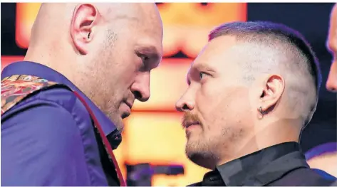  ?? FOTO: GOODWIN/DPA ?? Tyson Fury (links) und Alexander Usyk sollen sich nun am 18. Mai in Saudi-Arabien im Ring gegenübers­tehen.