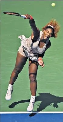  ??  ?? Full power: Serena Williams serves on her way to a three-set win against Maria Sakkari, of Greece