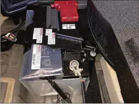  ?? JAMES HALDERMAN PHOTO ?? The 12-volt battery used in a Lexus NX 300h hybrid electric vehicle is located in the rear area under the floor.