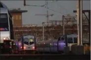  ?? JULIO CORTEZ — THE ASSOCIATED PRESS ?? New Jersey Transit trains sit on the tracks at the Hoboken Terminal in Hoboken, N.J., on Thursday.