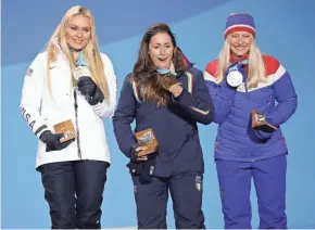  ?? MARK HOFFMAN/USA TODAY SPORTS ?? Bronze medal winner Lindsey Vonn of the United States, from left, Italian gold medal winner Sofia Goggia and Norwegian silver medalist Ragnhild Mowinckel celebrate during the alpine skiing downhill event medal ceremony Wednesday.