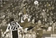  ?? AFP ?? ▪ Cristiano Ronaldo (C) scores during the UEFA Champions League quarterfin­al match between Juventus and Real Madrid, Turin, Italy, April 3