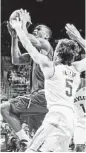  ?? Michael Bancale / AP ?? Baylor’s Brady Heslip did all he could Saturday, even chipping in on defense against Texas Tech’s Robert Turner.