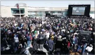  ?? AP PHOTO BY MARK HUMPHREY ?? A crowd watches a ceremony at the National Civil Rights Museum commemorat­ing the anniversar­y of the assassinat­ion of Rev. Martin Luther King Jr. Wednesday, April 4, in Memphis, Tenn. King was assassinat­ed on the balcony of the building, formerly the...