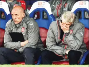  ?? GLYN KIRK/AFP ?? Arsenal manager Arsene Wenger (right) gestures during the 3-0 English Premier League loss to Crystal Palace at Selhurst Park on Wednesday night.