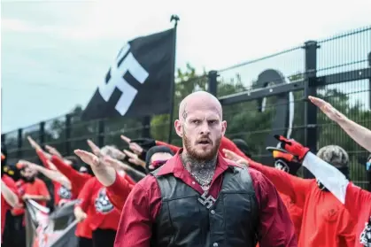  ?? Photograph: Stephanie Keith/Getty Images ?? Christophe­r Pohlhaus leads a rally with neo-Nazi groups Blood Tribe and Goyim Defense League in Orlando, Florida, on 2 September 2023.