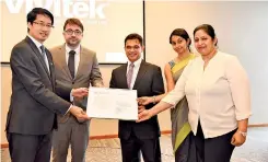  ??  ?? Consulus Group CEO Lawrence Chong (left) and Consulus Group North America and Europe Regional Director Dr. Paolo Frizzi (second from left) present the official appointmen­t document to Consulus Lanka CEO Shiraz Latiff (centre) and other Consulus Lanka...