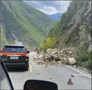  ?? (AP/Xinhua) ?? Fallen rocks are seen Monday on the road heading to Luding county, the epicenter of a quake in southwest China’s Sichuan Province.