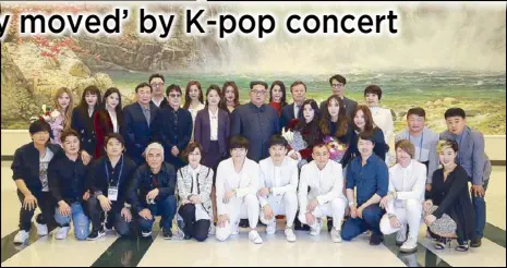  ??  ?? North Korean leader Kim Jong-un poses with South Korean pop stars in Pyongyang on Sunday.