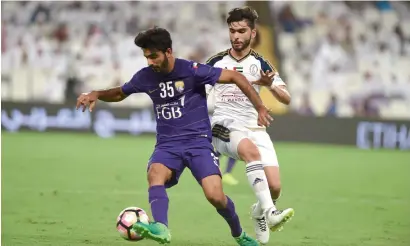  ?? Supplied photo ?? Al Ain’s Yousef Ahmed vies with a Al Wahda player during their Arabian Gulf League match on Saturday. —