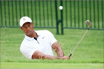  ?? ?? Tiger Woods warms up on the range ahead of a practice round at Southern Hills