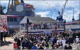  ?? PHOTOS BY DAVID SHARP — THE ASSOCIATED PRESS ?? A crowd attends the christenin­g ceremony for the future USS Basilone, in the background, on Saturday at Bath Iron Works in Bath, Maine.