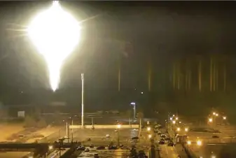  ?? Zaporizhzh­ia Nuclear Power Plant ?? A bright object lands near the Zaporizhzh­ia nuclear plant in March. Russia reportedly fired 60 rockets at Nikopol, a nearby city. Moscow’s troops seized the power plant early in the war.
