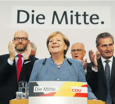  ?? SEAN GALLUP / GETTY IMAGES ?? German Chancellor Angela Merkel acknowledg­ed that gains for the AfD were the “biggest challenge” facing her government, and vowed to win voters back from the party that campaigned on a nationalis­t anti-immigrant platform.