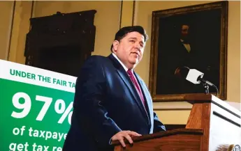  ?? JUSTIN L. FOWLER/THE STATE JOURNAL-REGISTER VIA AP ?? Gov. J.B. Pritzker unveils his graduated income tax plan during a press conference in the governor’s office at the Illinois State Capitol in March.