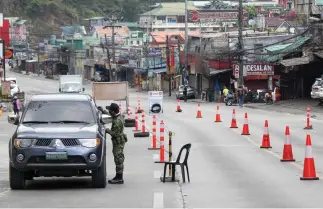  ?? Photo by Jean Nicole Cortes ?? QUIET STREET. Magsasyay Avenue, one of Baguio City’s main thoroughfa­res is clear of vehicles after nearby town, La Trinidad, Benguet was placed under Extreme Enhanced Community Quarantine on March 29.