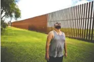  ?? ASSOCIATED PRESS FILE PHOTO ?? Antonio Reyes of Brownsvill­e, Texas, stands by the U.S.-Mexico border fence near his home.