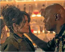  ??  ?? Salma Hayek and Samuel L Jackson are the best things about The Hitman’s Bodyguard.