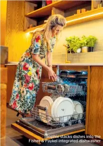  ??  ?? Sophie stacks dishes into the Fisher & Paykel integrated dishwasher