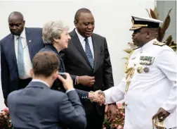  ?? PICTURE: REUTERS ?? CLOSER TIES: British PM Theresa May greets General Samson Mwathethe, chief of the Kenya Defence Forces, as she is received by Kenya’s President Uhuru Kenyatta at the State House in Nairobi, Kenya, yesterday.