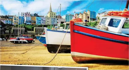  ??  ?? LOCAL COLOUR: Fishing boats on the beach at Tenby and, left, a room at Escape in Llandudno