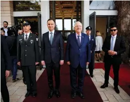  ?? (Ronen Zvulun/Reuters) ?? PRESIDENT REUVEN RIVLIN stands next to his polish counterpar­t, Andrzej Duda, in Jerusalem yesterday.