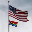  ?? Steph Chambers/Post-Gazette ?? An American flag and an LGBTQIA+ flag wave during Crafton’s first Pride Parade last June.