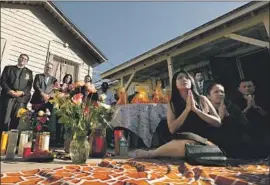  ?? Luis Sinco Los Angeles Times ?? A BUDDHIST CEREMONY honors victims of an Oct. 29 shooting in Long Beach. Across town, people filled a mosque to mourn a family killed on Halloween.