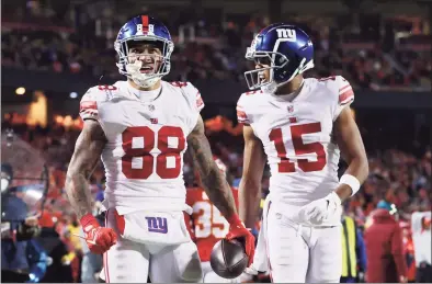  ?? Jamie Squire / Getty Images ?? The Giants’ Evan Engram, left, and Collin Johnson react after Engram’s touchdown during the second half against the Kansas City Chiefs on Monday.
