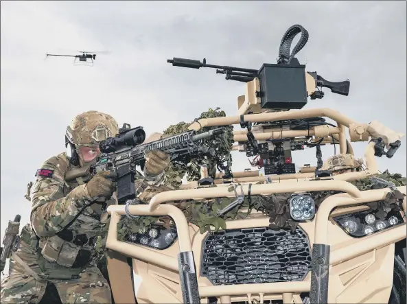  ??  ?? AUTONOMOUS Royal Marines of 40 Commando with a Ghost drone during a demonstrat­ion for the First Sea Lord and guests during AAF4.0 DV day