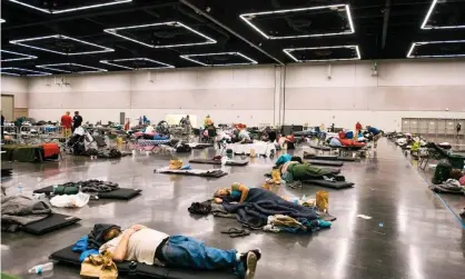  ??  ?? ‘People rest at the Oregon Convention Center cooling station in Oregon, Portland on June 28, 2021, as a heatwave moves over much of the United States’ Photograph: Kathryn Elsesser/AFP/Getty Images