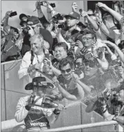  ?? ADREES LATIF/ REUTERS ?? Lewis Hamilton sprays champagne after winning the first Formula One race in the United States since 2007.