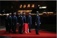  ?? (AP/Christophe Ena) ?? The coffin with soils from the U.S., France and Monaco is carried toward the Pantheon monument Tuesday in Paris, France, where Josephine Baker is to symbolical­ly be inducted, becoming the first Black woman to receive France’s highest honor. Her body will stay in Monaco at the request of her family. Video at arkansason­line. com/121baker/.