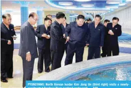  ?? — AFP ?? PYONGYANG: North Korean leader Kim Jong Un (third right) visits a newlyconst­ructed Taedong River seafood restaurant.