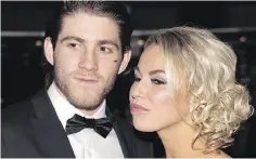  ?? TONY CALDWELL / POSTMEDIA NEWS ?? NHLer Mike Hoffman, with fiancée Monika Caryk, denies cyberbully­ing. “There is a 150 per cent chance (we) are not involved.”