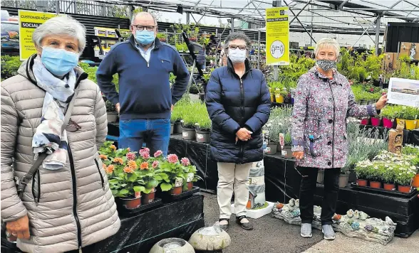 ??  ?? Ger Canning of Canning’s Spar House and Garden Centre presenting very generous sponsorshi­p to Carraroe and District Regenerati­on Associatio­n members Dympna O’Loughlin, Antony McGoldrick,