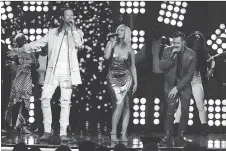  ?? CHRIS PIZZELLO/THE ASSOCIATED PRESS ?? Brian Kelley, left, Bebe Rexha and Tyler Hubbard have found Billboard success with Meant to Be.