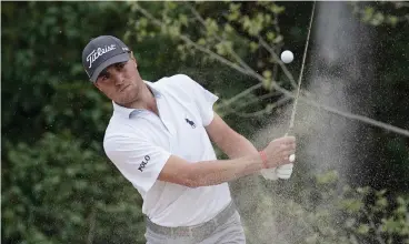  ?? Associated Press ?? ■ Justin Thomas plays a shot from a bunker on the second hole during round five at the Dell Technologi­es Match Play golf tournament Saturday in Austin.